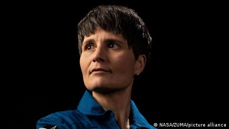 Samantha Cristoforetti in a blue shirt, looking to the right of the camera lens