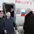 Russia's President Vladimir Putin (2nd L) and Belarusian President Alexander Lukashenko (R front) arrive by helicopter at the Vostochny