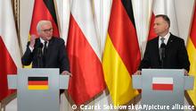 German President Frank-Walter Steinmeier, left, and Polish President Andrzej Duda attend a news conference during their meeting in Warsaw, Poland, Tuesday, April 12, 2022. (AP Photo/Czarek Sokolowski)