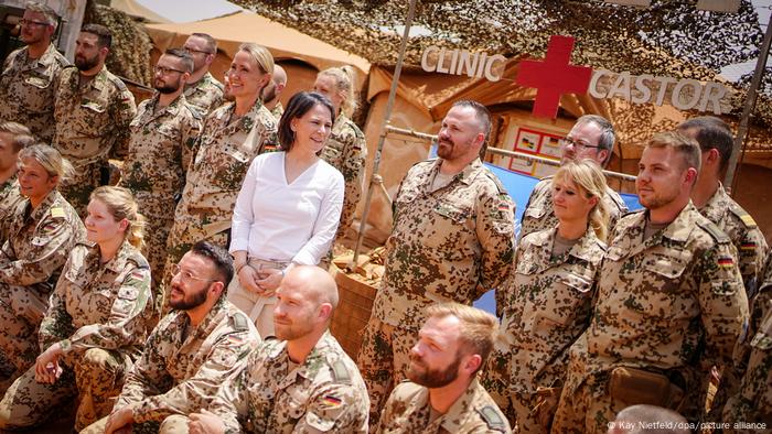 German Foreign Minister Annalena Baerbock stands with Bundewehr soldiers at a military camp in Mali