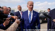 President Joe Biden speaks to reporters before boarding Air Force One at Des Moines International Airport, in Des Moines Iowa, Tuesday, April 12, 2022, en route to Washington. Biden said that Russia's war in Ukraine amounted to a genocide, accusing President Vladimir Putin of trying to wipe out the idea of even being a Ukrainian.(AP Photo/Carolyn Kaster)