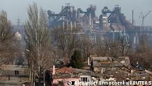A view shows a plant of Azovstal Iron and Steel Works company behind buildings damaged in the course of Ukraine-Russia conflict in the besieged southern port city of Mariupol, Ukraine March 28, 2022. REUTERS/Alexander Ermochenko