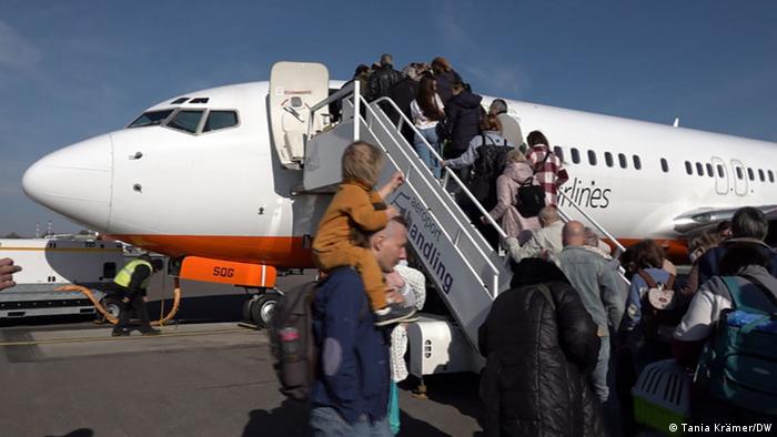 Refugees boarding a plane