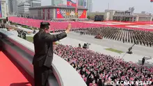 This picture taken on April 15, 2021 and released from North Korea's official Korean Central News Agency (KCNA) on April 16 shows North Korean leader Kim Jong Un (C) waving to the crowd at Kim Il Sung Square to mark the Day of the Sun, the 110th birth anniversary of late North Korean leader Kim Il Sung, in Pyongyang. (Photo by KCNA VIA KNS / AFP) / - South Korea OUT / ---EDITORS NOTE--- RESTRICTED TO EDITORIAL USE - MANDATORY CREDIT AFP PHOTO/KCNA VIA KNS - NO MARKETING NO ADVERTISING CAMPAIGNS - DISTRIBUTED AS A SERVICE TO CLIENTS
THIS PICTURE WAS MADE AVAILABLE BY A THIRD PARTY. AFP CAN NOT INDEPENDENTLY VERIFY THE AUTHENTICITY, LOCATION, DATE AND CONTENT OF THIS IMAGE. / 