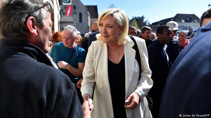 Marine Le Pen meets with supporters during a campaign visit
