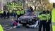 Extinction Rebellion protesters hold up a huge banner outside the UK Parliament Extinction Rebellion protesters hold up a huge banner outside the UK Parliament