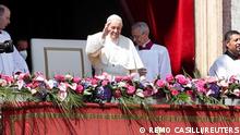 Pope Francis greets the crowd before reading his Urbi et Orbi (To the City and the World) message from the balcony overlooking St. Peter's Square, on Easter Sunday, at the Vatican April 17, 2022. REUTERS/Remo Casilli 