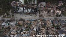 IRPIN, UKRAINE - APRIL 18: (EDITORS NOTE: This photograph was created using a drone) Destroyed houses are seen next to heavily damaged apartment buildings on April 18, 2022 in Irpin, Ukraine. (Photo by Alexey Furman/Getty Images)