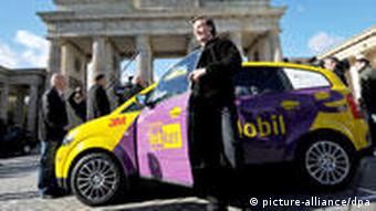 An electric car in front of the Brandenburg Gate