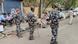 Members of the Indian security personnel wait on the roads as they conducted raids at PFI offices across the country. Members of the Indian security personnel wait on the roads as they conducted raids at PFI offices across the country.