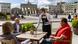 waiter serving guests in cafe by the Brandenburg Gate waiter serving guests in cafe by the Brandenburg Gate