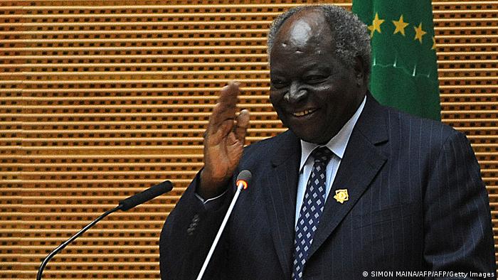 Kenya's president Mwai Kibaki gestures during an African Union meeting on January 27, 2013 in Addis Ababa