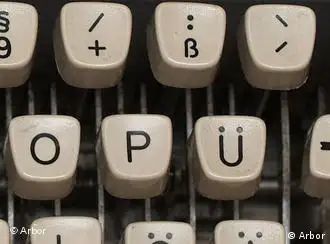 The upper right portion of a German 1964 Olympia typewriter showing the placement of ß and umlauts