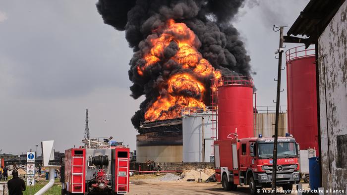 Fire engulfing an oil storage tank after an explosion 