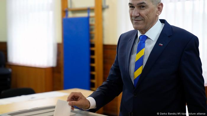  Janez Jansa voting, wearing a yellow and blue striped tie