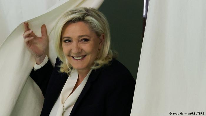  Marine Le Pen emerging from polling booth in Henin-Beaumont