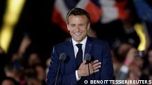 French President Emmanuel Macron gestures as he arrives to deliver a speech after being re-elected as president, following the results in the second round of the 2022 French presidential election, during his victory rally at the Champs de Mars in Paris, France, April 24, 2022. REUTERS/Benoit Tessier