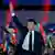 Macron waves to the crowd at his victory speech