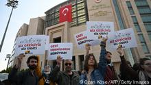 Demonstrators including lawyers and opposition lawmakers hold up placards that read, The Gezi resistance continues, as they gather in support of jailed civil society leader Osman Kavala outside Istanbul courthouse, on April 25, 2022. - A leading Turkish rights defender expects to learn April 25, 2022, if he can walk free after more than four years in jail without a conviction or will spend the rest of his days behind bars. The case of Paris-born philanthropist Osman Kavala has gnawed on Turkey's ties with Western allies since his arrest in October 2017. (Photo by OZAN KOSE / AFP) (Photo by OZAN KOSE/Afp/AFP via Getty Images)