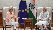 In this photo released by India's Press Information Bureau, EU Commission President Ursula von der Leyen, left and Indian Prime Minister Narendra Modi sit during their meeting in New Delhi, India, Monday, April 25, 2022. (Press Information Bureau via AP)