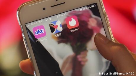 A phone screen showing the dating apps OkCupid, Cofee Meets Bagel and Tinder