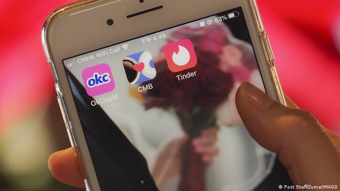 A phone screen showing the dating apps OkCupid, Cofee Meets Bagel and Tinder