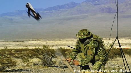 A soldier firing off a Switchblade drone
