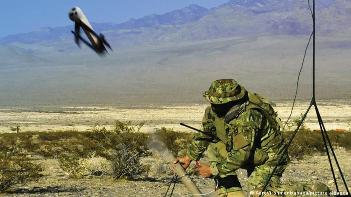 A soldier firing off a Switchblade drone