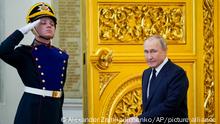 Russian President Vladimir Putin arrives to deliver his speech during an awarding ceremony for the Russian Olympic Committee medalists of the XXIV Olympic Winter Games in Beijing and members of the Russian Paralympic team, at the Kremlin in Moscow, Russia, Tuesday, April 26, 2022. (AP Photo/Alexander Zemlianichenko)