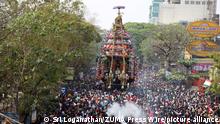 March 15, 2022, Chennai, Tamil Nadu, India: Hindu devotees pull a chariot decorated with flowers and statues carrying a diety of Hindu God Shiva during an annual temple car festival procession in Chennai. (Credit Image: Â© Sri Loganathan/ZUMA Press Wire