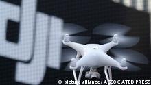 FILE - A Phantom 4, developed by major Chinese consumer-drone maker DJI, flies during its demonstration flight in Tokyo, Thursday, March 3, 2016. Drone company DJI Technology Co said Tuesday, April 27, 2022, that it has temporarily suspended business activities in Russia and Ukraine to prevent use of its drones in combat, in a rare case of a Chinese company pulling out of Russia. (AP Photo/Shizuo Kambayashi, File)