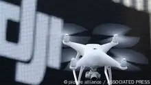 FILE - A Phantom 4, developed by major Chinese consumer-drone maker DJI, flies during its demonstration flight in Tokyo, Thursday, March 3, 2016. Drone company DJI Technology Co said Tuesday, April 27, 2022, that it has temporarily suspended business activities in Russia and Ukraine to prevent use of its drones in combat, in a rare case of a Chinese company pulling out of Russia. (AP Photo/Shizuo Kambayashi, File)