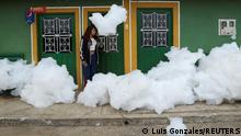 27.04.2022
A woman looks at the polluting foam generated by a river full of waste, at the entrance of her house, in Mosquera, Colombia April 27, 2022. REUTERS/Luisa Gonzalez