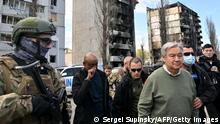 UN Secretary-General Antonio Guterres (3R) walks during his visit in Borodianka, outside Kyiv, on April 28, 2022. - UN Secretary-General Antonio Guterres arrived on April 28, 2022 to the town of Borodianka outside Kyiv where Russian forces were accused of having killed civilians, an AFP journalist on the scene reported. (Photo by Sergei SUPINSKY / AFP) (Photo by SERGEI SUPINSKY/AFP via Getty Images)