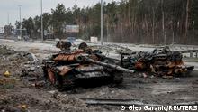 A destroyed Russian tank is seen on a highway, as Russia's attack on Ukraine continues, in Kyiv region, Ukraine, April 5, 2022. REUTERS/Gleb Garanic