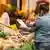Shoppers are seen at a vegetable stall at Carlstadt in Duesseldorf, Germany