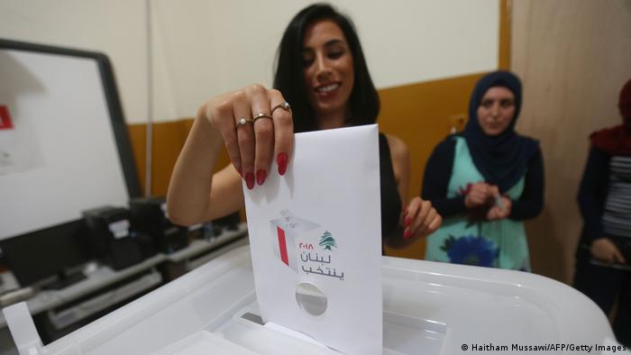 A Lebanese woman casts her vote