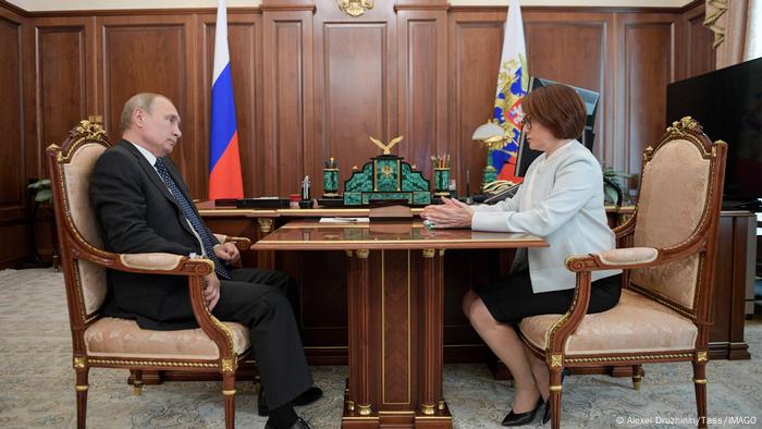 Russian President Vladimir Putin (L) and Central Bank of Russia Governor Elvira Nabiullina during a meeting at the Kremlin