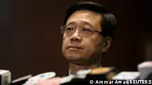 FILE PHOTO: Secretary of Security John Lee Ka-Chiu announces the withdrawal of the extradition bill, in Hong Kong, China October 23, 2019. REUTERS/Ammar Awad/File Photo