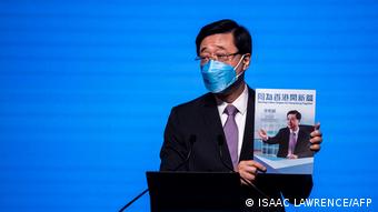 Hong Kong's former chief secretary John Lee introduces his election manifesto at an event in Hong Kong on April 29