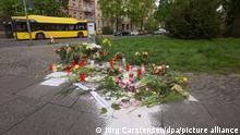 Dort, wo gestern eine sechsfache Mutter mit Messerstichen getötet wurde, wurden Blumen und Kerzen der Anteilnahme abgelegt.