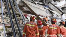 This photo taken on April 29, 2022 shows rescuers searching for survivors at a collapsed six-storey building in Changsha, central Chinas Hunan province. - Dozens of people were trapped under a building which collapsed in central China, officials said on April 30, as rescuers clawed through the rubble and used buzzsaws to pull several survivors free. - China OUT (Photo by CNS / AFP) / China OUT (Photo by -/CNS/AFP via Getty Images)