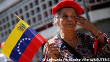A supporter of Venezuela's President Nicolas Maduro participates in the celebration of the commemorate May Day in Caracas, Venezuela May 1, 2022. REUTERS/Leonardo Fernandez Viloria
