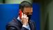 Spanish Prime Minister Pedro Sanchez speaks on a phone with a red case while wearing a black facemask Spanish Prime Minister Pedro Sanchez speaks on a phone with a red case while wearing a black facemask