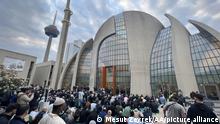 COLOGNE, GERMANY - MAY 02: People gather to perform Eid al-Fitr prayer at Cologne Central Mosque in Cologne, Germany on May 02, 2022. Mesut Zeyrek / Anadolu Agency