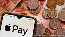 March 4, 2022, Ukraine: In this photo illustration, the Apple Pay logo is displayed on a smartphone with Russian money in the background. Apple has joined the sanctions against Russia. (Credit Image: © Igor Golovniov/SOPA Images via ZUMA Press Wire
