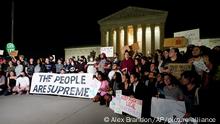 A crowd of people gather outside the Supreme Court, early Tuesday, May 3, 2022 in Washington. A draft opinion circulated among Supreme Court justices suggests that earlier this year a majority of them had thrown support behind overturning the 1973 case Roe v. Wade that legalized abortion nationwide, according to a report published Monday night in Politico. It's unclear if the draft represents the court's final word on the matter. The Associated Press could not immediately confirm the authenticity of the draft Politico posted, which if verified marks a shocking revelation of the high court's secretive deliberation process, particularly before a case is formally decided. (AP Photo/Alex Brandon)