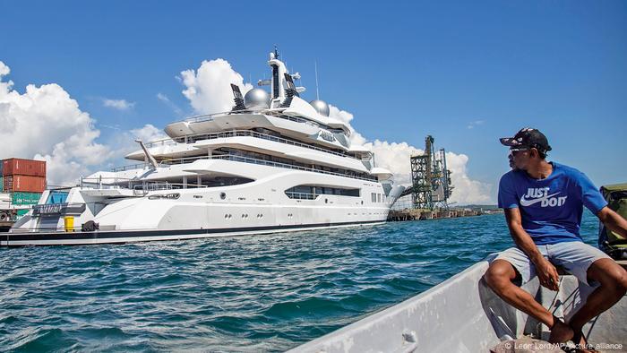 Boat captain Emosi Dawai looks at the superyacht Amadea where it is docked at the Queens Wharf in Lautoka, Fiji