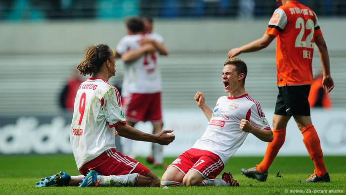 Yussuf Poulsen and Joshua Kimmich celebrate a goal