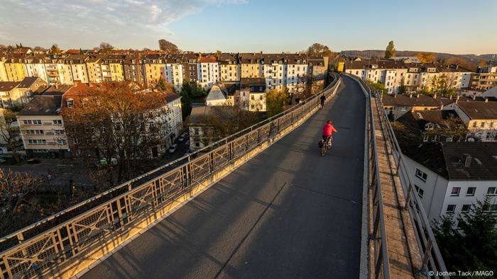 An overview of a railroad that was repurposed into a motorbike path